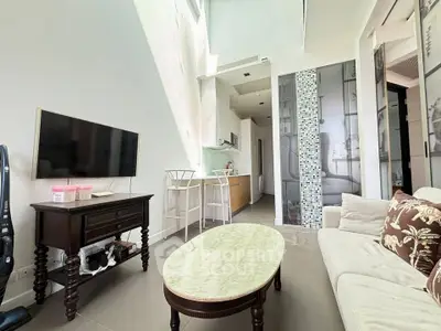 Modern living room with high ceiling and stylish decor