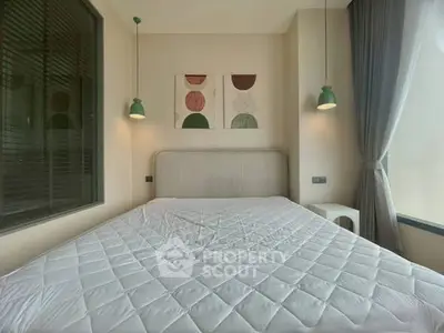 Cozy bedroom with modern decor and ample natural light