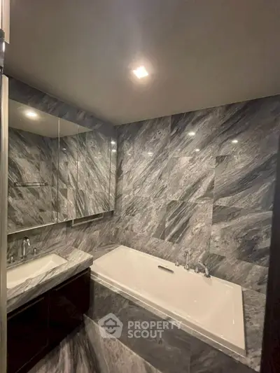 Luxurious marble bathroom with elegant bathtub and modern fixtures