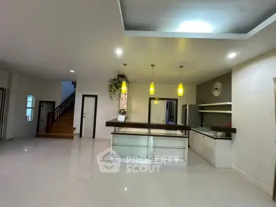 Spacious modern kitchen with open layout and stylish lighting