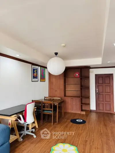 Spacious living room with wooden flooring and modern furniture