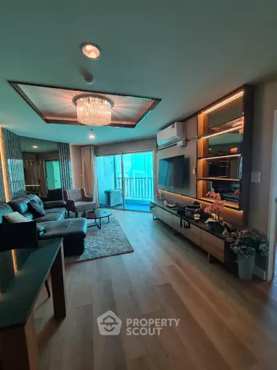 Luxurious living room with modern decor and large windows offering natural light and a stunning view.