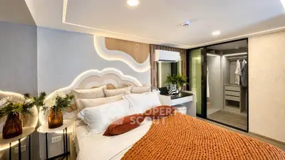 Luxurious bedroom with modern design, featuring ambient lighting and stylish decor.