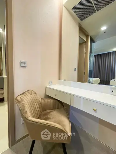 Modern bedroom with elegant chair and stylish vanity desk