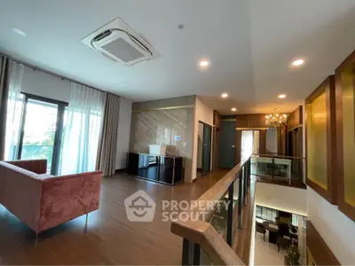 Spacious modern living room with elegant decor and large windows for natural light.