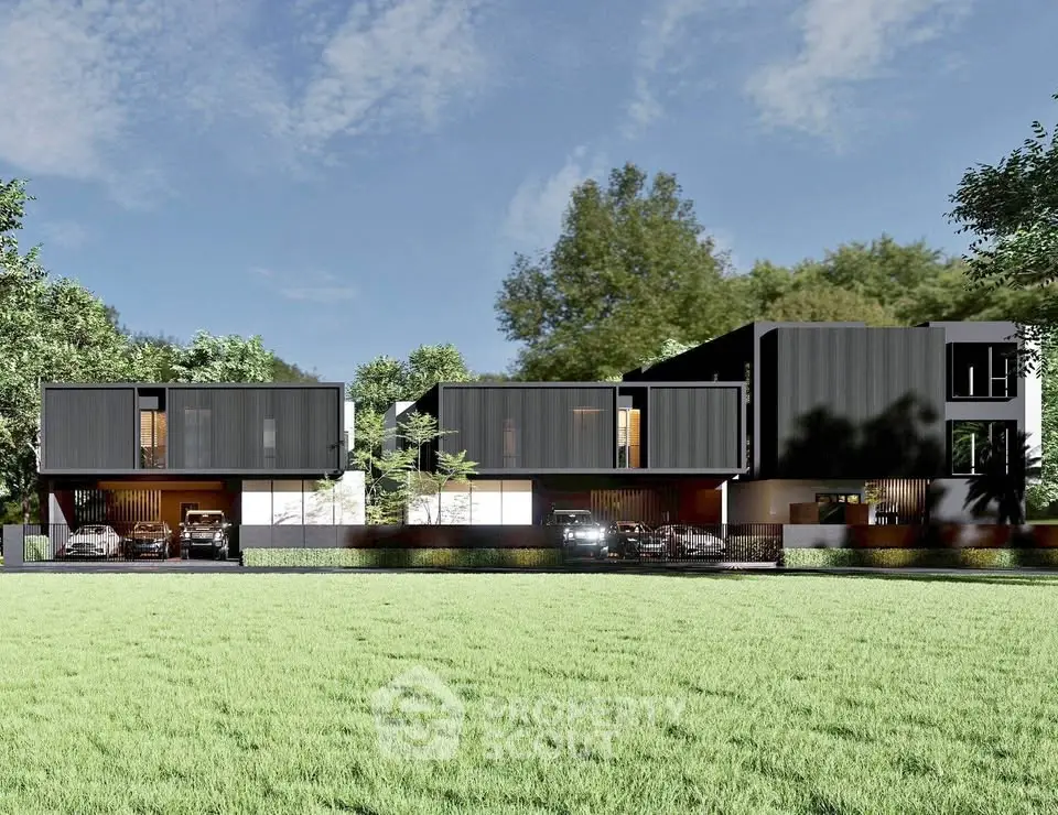 Modern architectural design of luxury homes with sleek black facade and spacious green lawn.