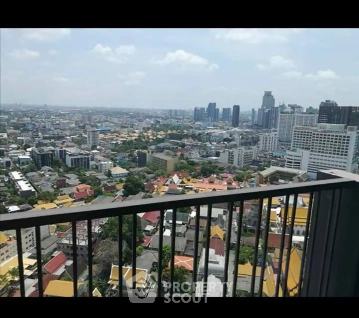 Stunning cityscape view from a high-rise balcony, perfect for urban living enthusiasts.