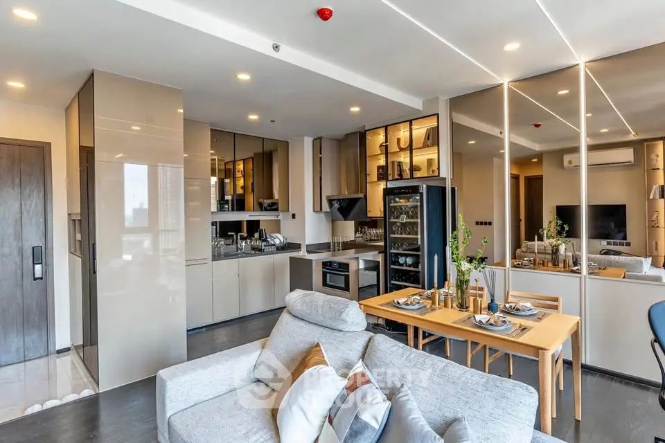 Modern open-plan living room and kitchen with sleek design and stylish furnishings