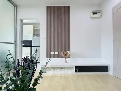 Modern minimalist living room with open kitchen and stylish decor