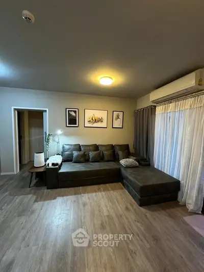 Spacious living room with modern decor and large sectional sofa