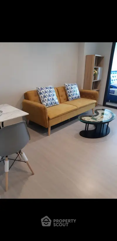 Modern living room with yellow sofa and stylish decor