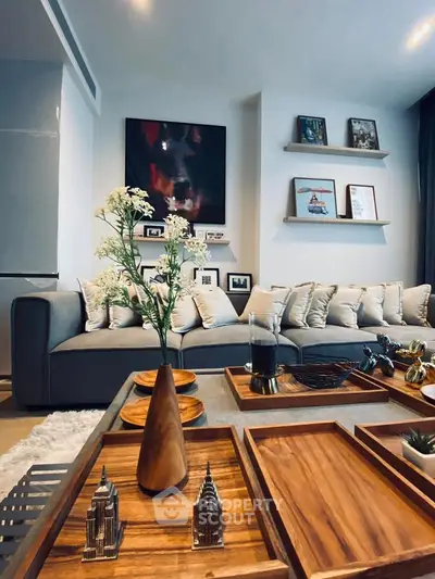 Stylish living room with modern decor and cozy seating area, perfect for relaxation and entertaining.