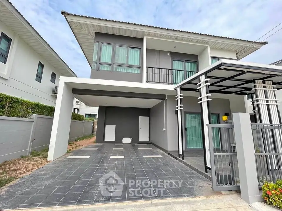 Modern two-story house with sleek design and spacious driveway