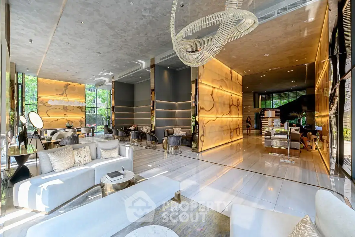 Luxurious modern lobby with elegant lighting and stylish seating in a high-end building.