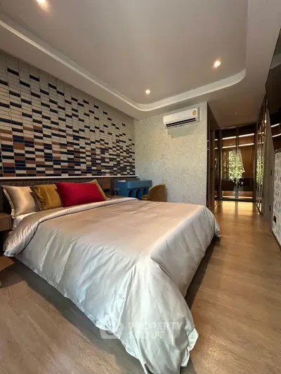 Luxurious modern bedroom with stylish decor and ambient lighting