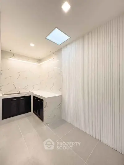 Modern minimalist bathroom with marble accents and sleek design