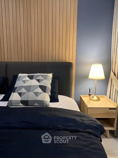 Cozy modern bedroom with stylish decor and ambient lighting