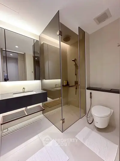 Modern bathroom with sleek glass shower and contemporary fixtures