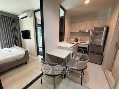 Modern compact apartment with open kitchen and cozy bedroom