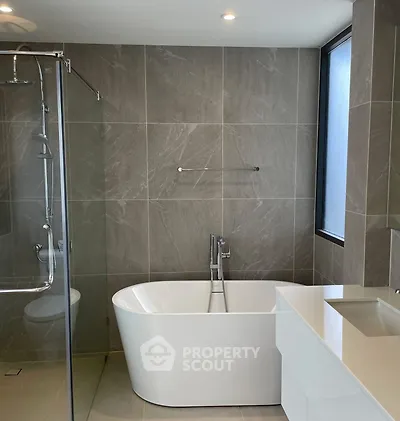 Modern bathroom with freestanding bathtub and sleek design