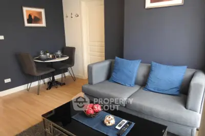 Modern living room with stylish decor and cozy seating area, perfect for relaxation and entertaining.