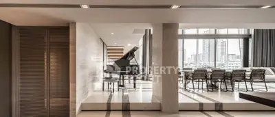 Luxurious modern living room with grand piano and city view, perfect for entertaining.