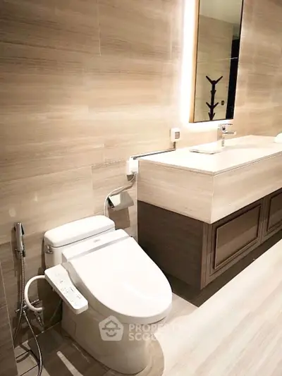 Luxurious modern bathroom with sleek fixtures and elegant lighting, perfect for a sophisticated home.
