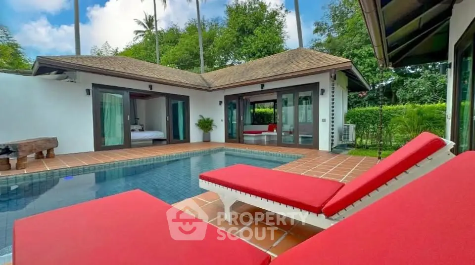 Luxurious villa with private pool and lush garden, perfect for relaxation and tropical living.