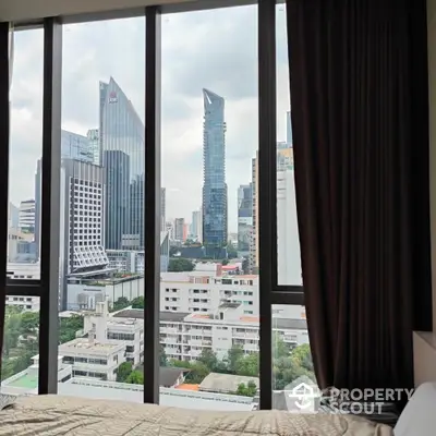 Stunning cityscape view from modern bedroom with floor-to-ceiling windows