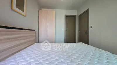 Modern bedroom with minimalist design and wooden accents