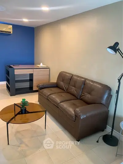 Cozy living room with leather sofa and modern decor
