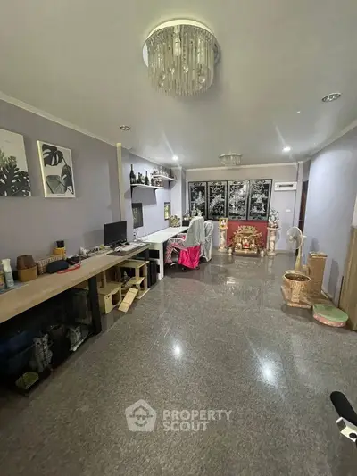 Spacious living room with modern decor and ample natural light