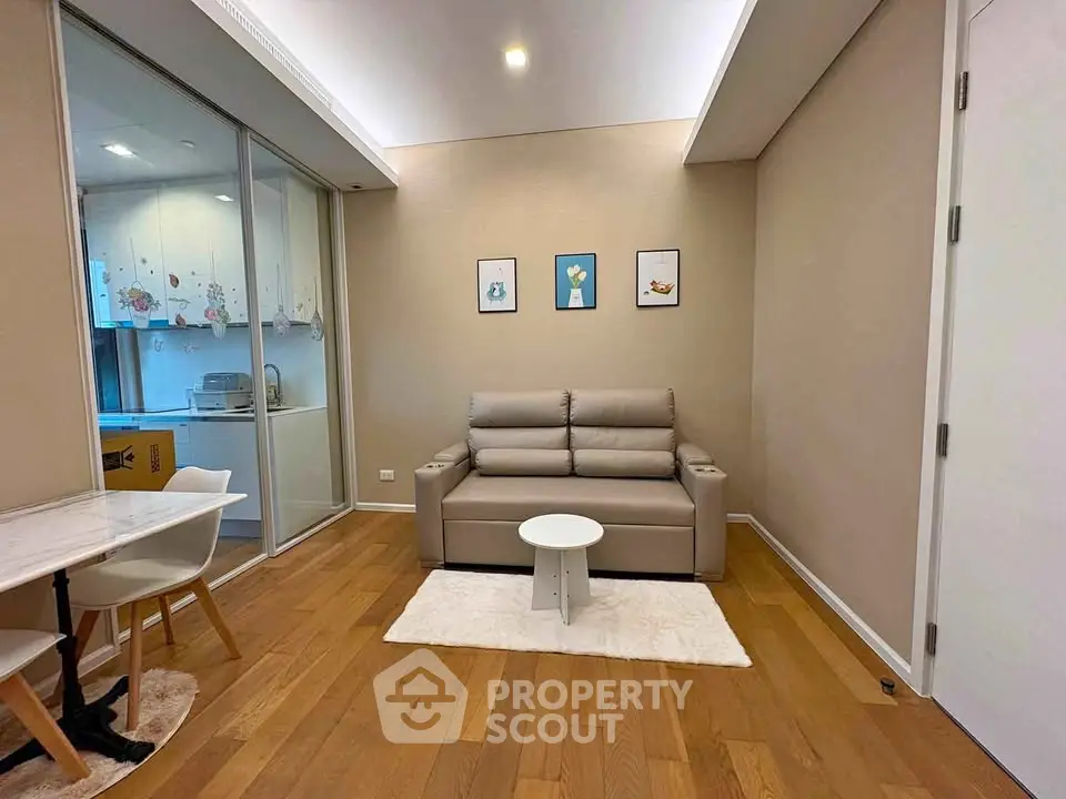 Modern living room with cozy sofa and open kitchen layout