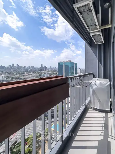 Stunning cityscape view from a modern balcony with sleek railing and air conditioning unit.