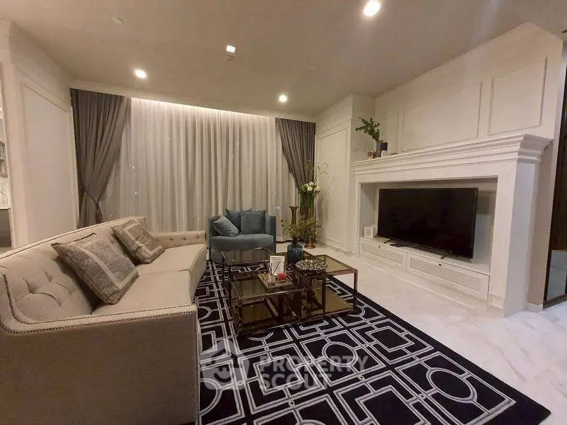 Luxurious living room with elegant decor, plush seating, and modern entertainment center.