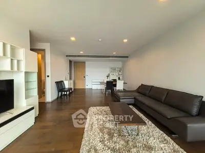 Spacious modern living room with sleek furniture and hardwood floors