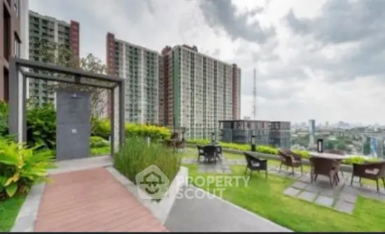 Stunning rooftop garden with city views and outdoor seating area.