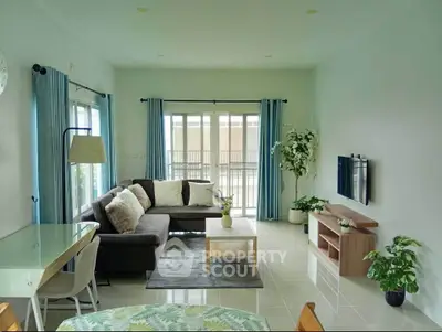 Bright and modern living room with large windows and stylish decor