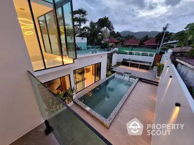 Luxurious modern villa with private pool and stunning mountain views, perfect for relaxation and entertainment.