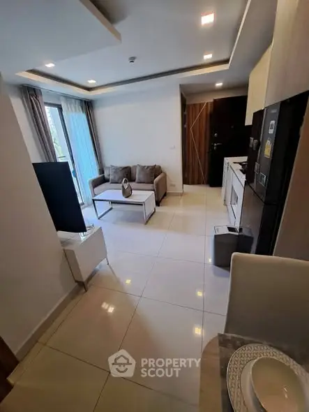 Modern living room with open kitchen layout and stylish decor