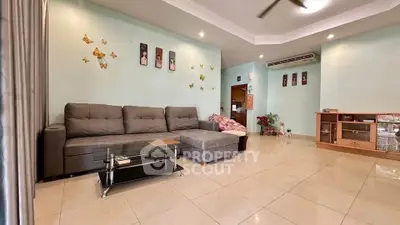 Spacious living room with modern decor and comfortable seating