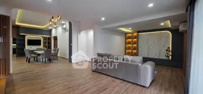 Spacious modern living room with elegant dining area and stylish lighting