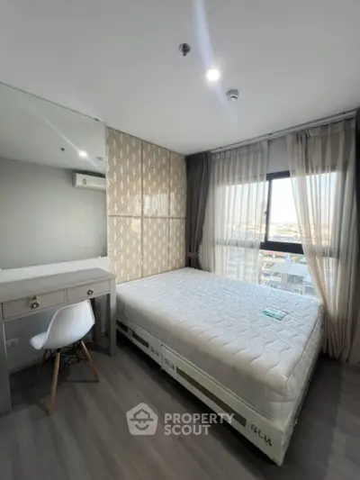 Modern bedroom with large window and stylish decor in high-rise apartment