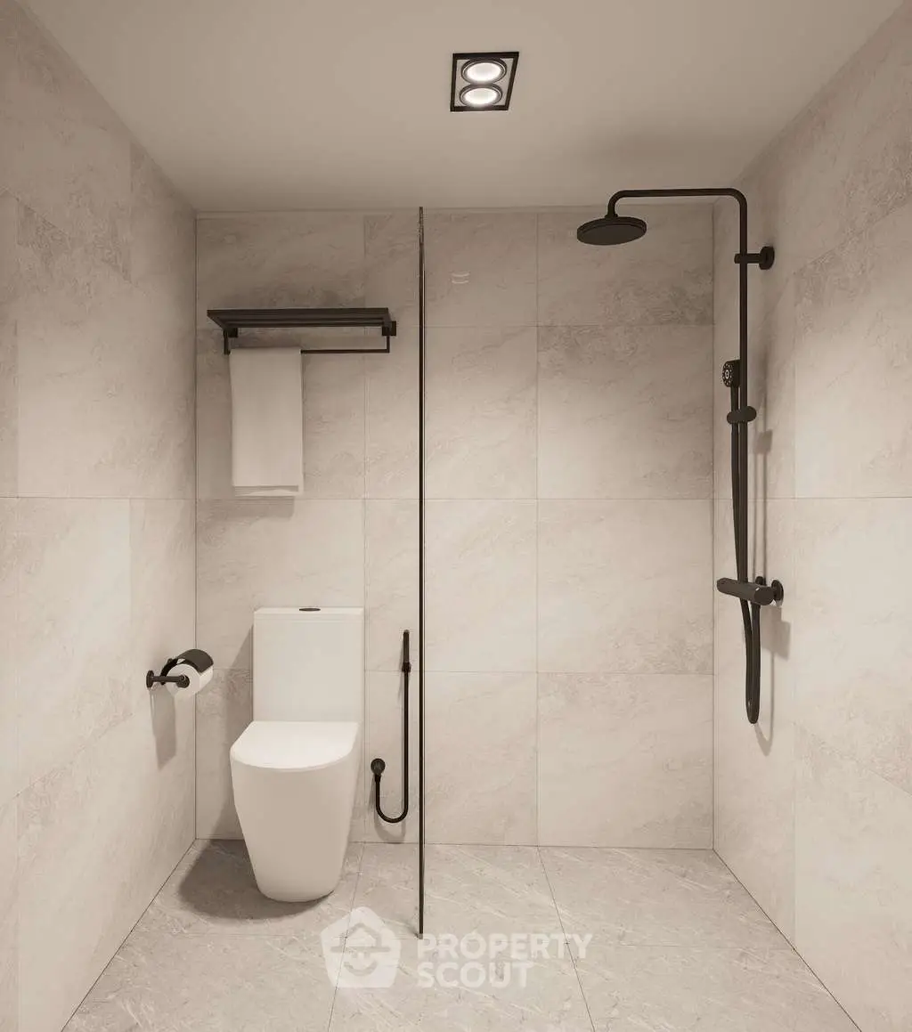 Modern minimalist bathroom with sleek fixtures and elegant tile design.