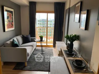 Modern living room with stylish decor and balcony view in urban apartment.