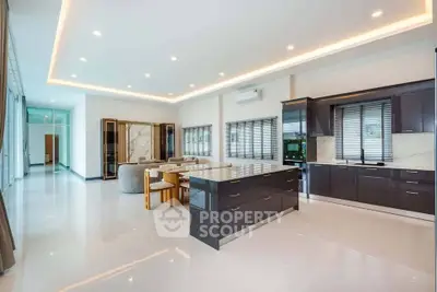 Spacious modern kitchen with sleek cabinetry and open layout in luxury home