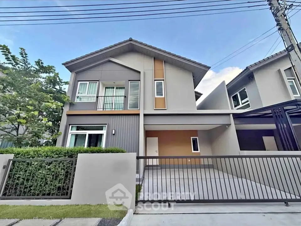 Modern two-story house with sleek design and spacious driveway