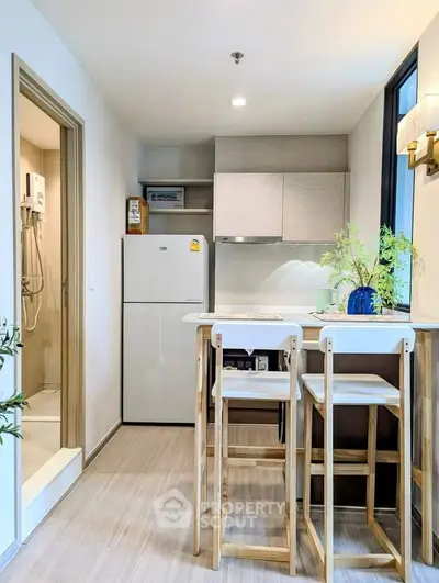 Modern kitchen with open layout and breakfast bar in stylish apartment