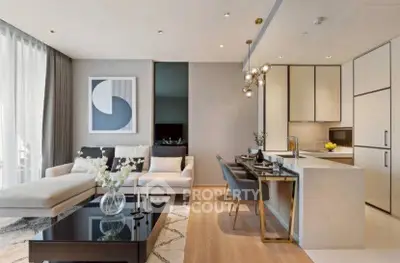 Modern open-plan living room and kitchen with stylish decor and natural light.