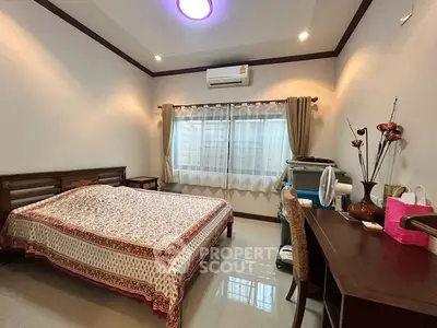 Cozy bedroom with elegant decor and natural light, featuring a comfortable bed and stylish furnishings.
